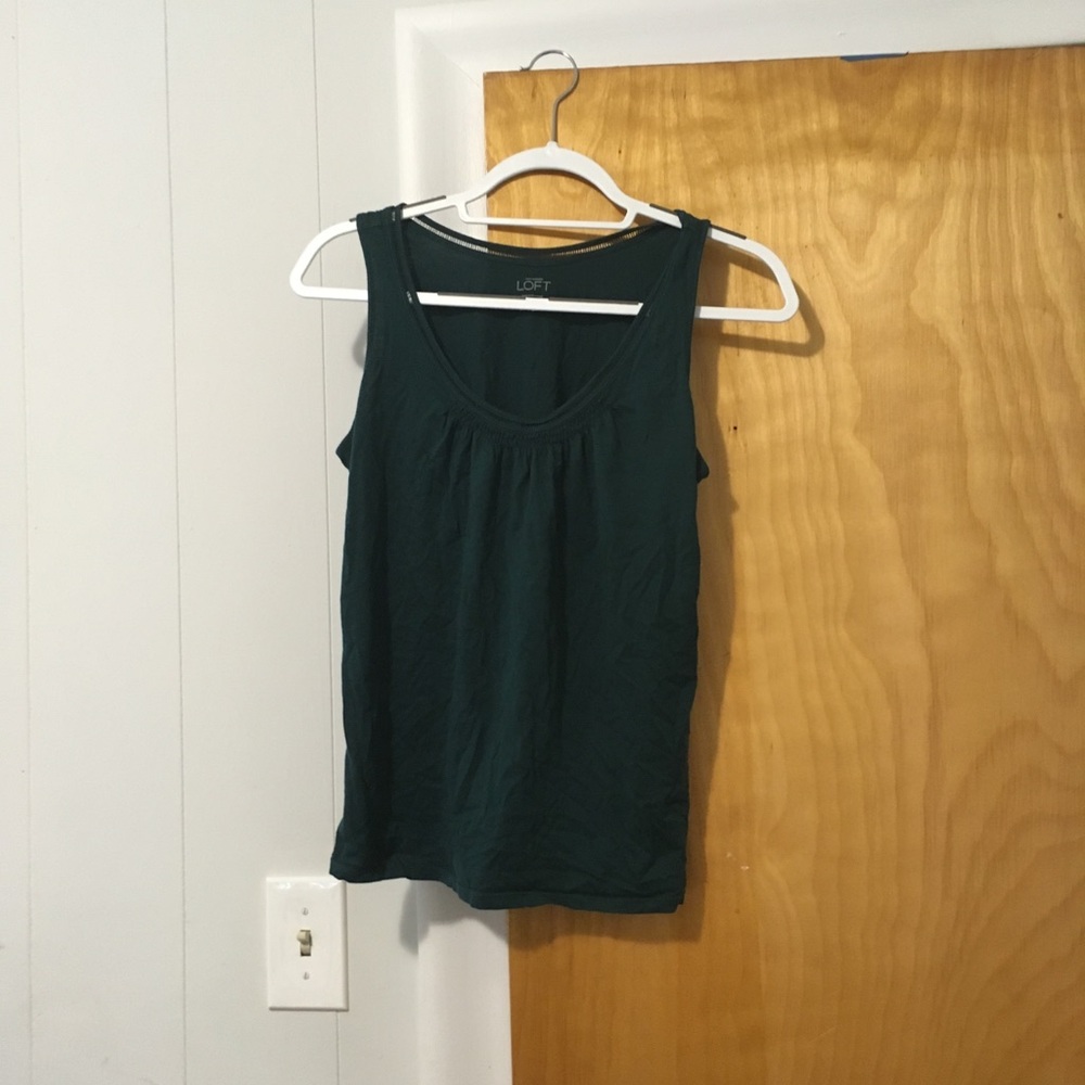 Gently used tank top with delicate neck details